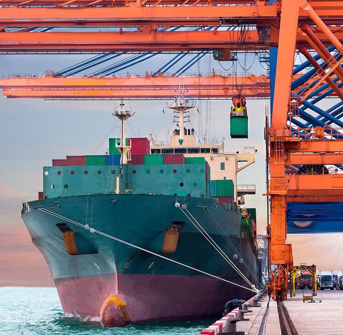 Container ship being loaded at port