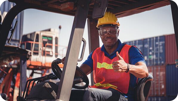 Forklift operator in a warehouse